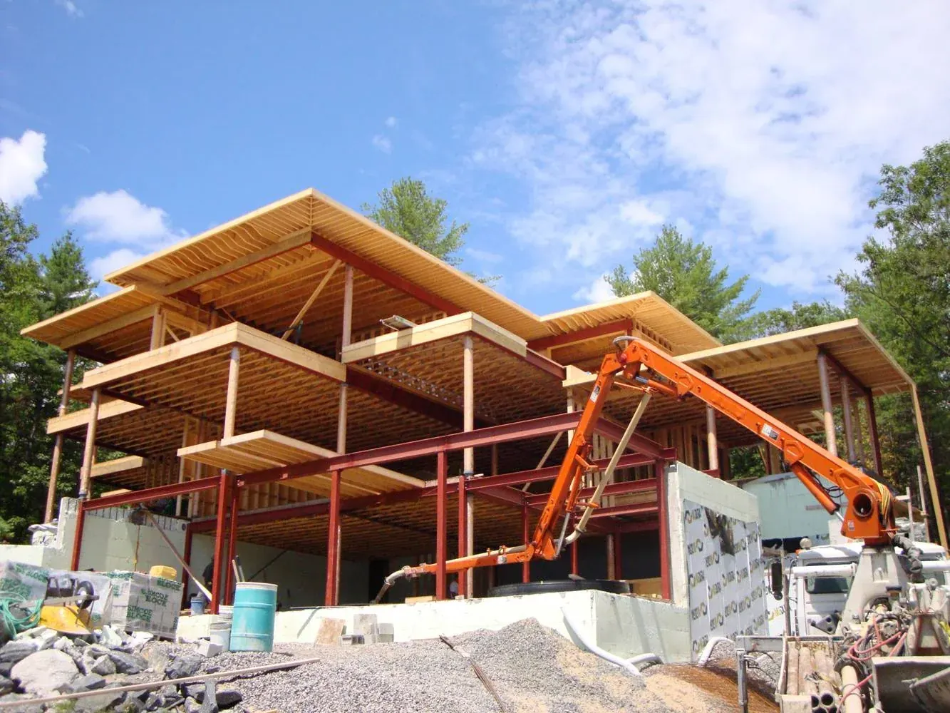 Steel and timber frame going up on the Bass Island build in Ontario's cottage country